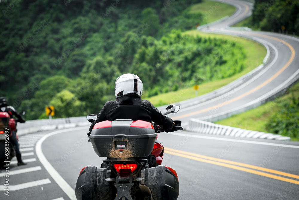 motorcycle on the road rides away. Travel on vacation, enjoy the nature trail. motorcycle in a sunny motorbike on the road riding.with sunset light. copyspace for your individual text. motorcycle on the road rides away. Travel on vacation, enjoy the nature trail. motorcycle in a sunny motorbike on the road riding.with sunset light. copyspace for your individual text.