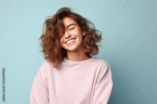 Happiness European Woman In Gray Sweatshirt On Pastel Background