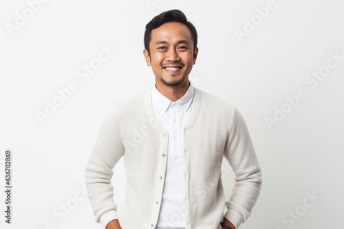 Portrait of a happy young asian man isolated over white background