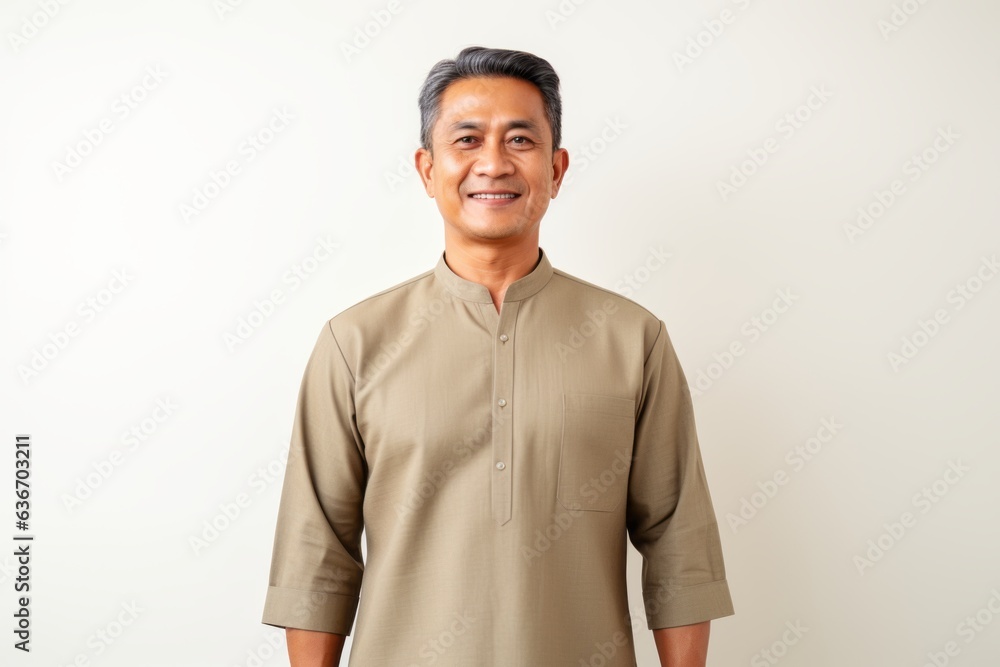 Portrait of happy mature asian man smiling and looking at camera Portrait of happy mature asian man smiling and looking at camera