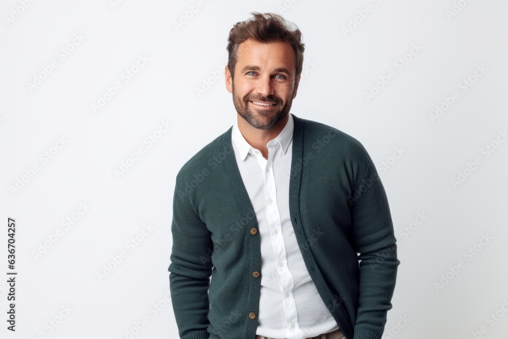 Lifestyle portrait of a Russian man in his 30s in a white background wearing a chic cardigan Lifestyle portrait of a Russian man in his 30s in a white background wearing a chic cardigan