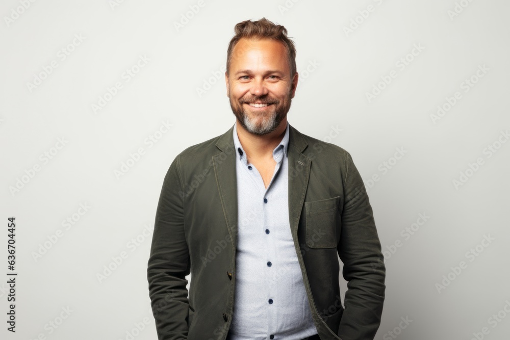 Portrait of a handsome man in a green jacket on a white background Portrait of a handsome man in a green jacket on a white background