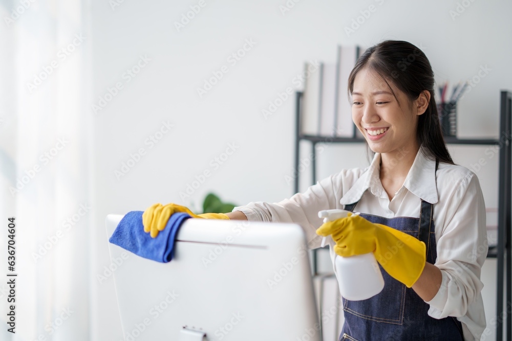Asian young cleaning service woman worker clean table at home. Beautiful young girl housekeeper cleaner feel happy and wiping messy dirty counter for housekeeping housework or chores. Asian young cleaning service woman worker clean table at home. Beautiful young girl housekeeper cleaner feel happy and wiping messy dirty counter for housekeeping housework or chores.