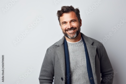 Portrait of a handsome man smiling at camera isolated on a white background