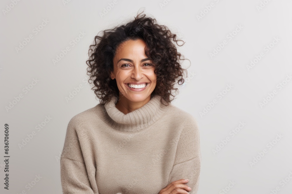 Portrait of smiling african american woman with curly hair looking at camera