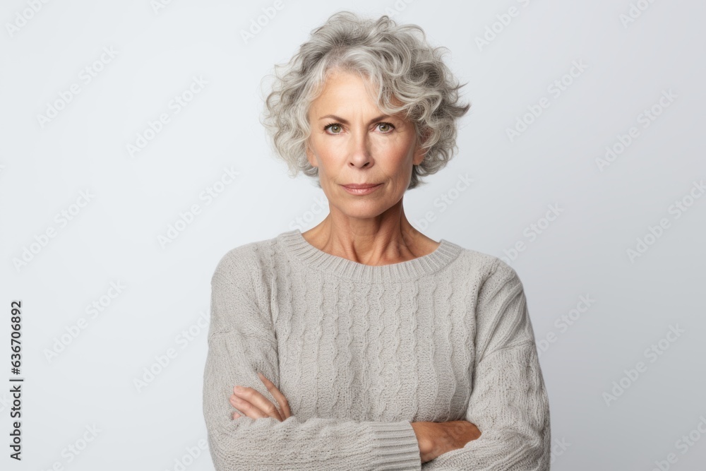 Portrait of a senior woman with grey hair on a white background Portrait of a senior woman with grey hair on a white background