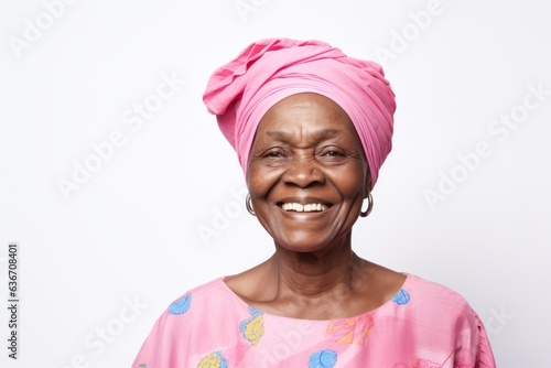 Group portrait of a Nigerian woman in her 80s in a white background wearing a foulard