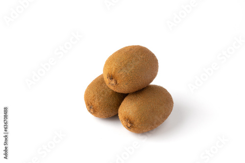 Three kiwi fruits on a white background.