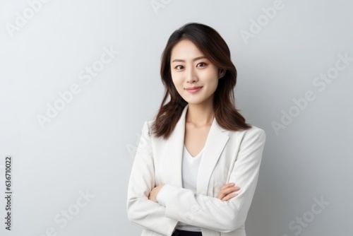 Portrait of asian business woman in white suit on white background