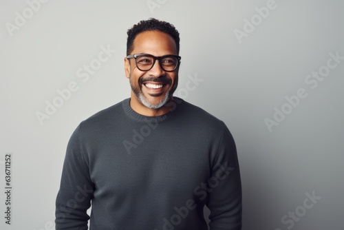 Handsome african american man in eyeglasses smiling at camera © Anne-Marie Albrecht