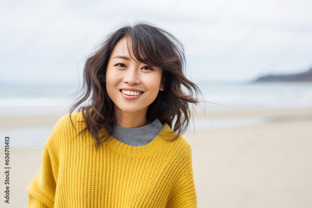 Portrait of a beautiful young asian woman smiling on the beach Portrait of a beautiful young asian woman smiling on the beach