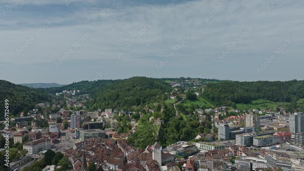 Aerial view of Swiss City of Baden, village Ennetbaden and City of Wettingen with scenic landscape and woodland on a sunny summer noon. Movie shot August 19th, 2023, Baden, Switzerland. Aerial view of Swiss City of Baden, village Ennetbaden and City of Wettingen with scenic landscape and woodland on a sunny summer noon. Movie shot August 19th, 2023, Baden, Switzerland.