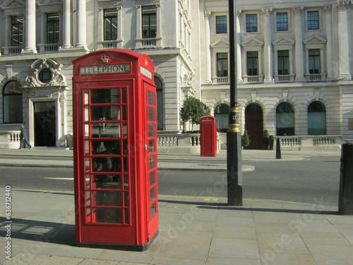 Red telephone boxes on a London street © Tetiana