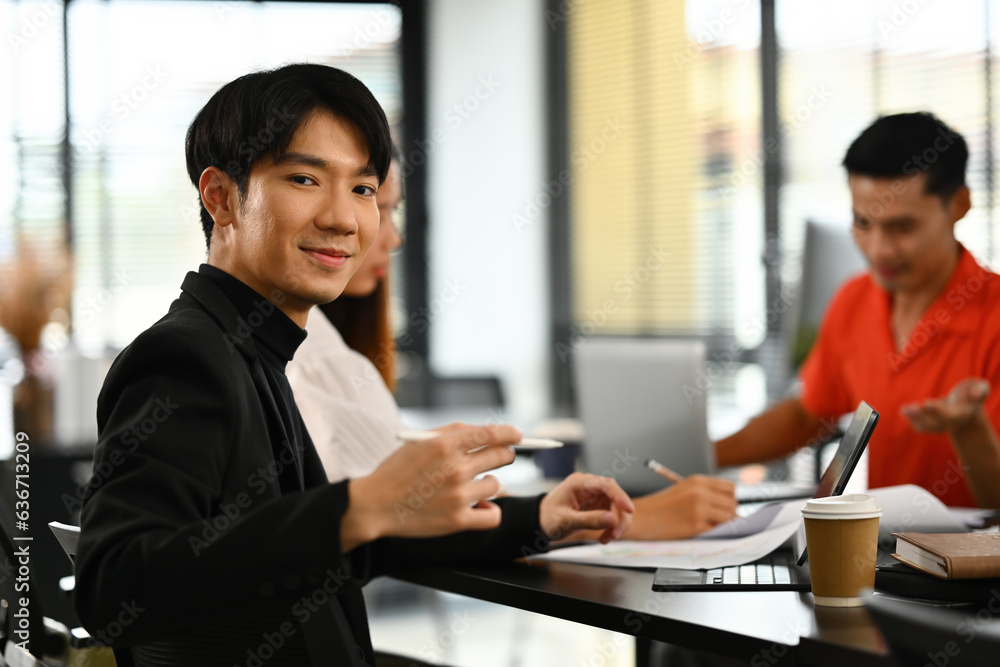 Portrait image of a Young businessman in the meeting room, creative worker conference.