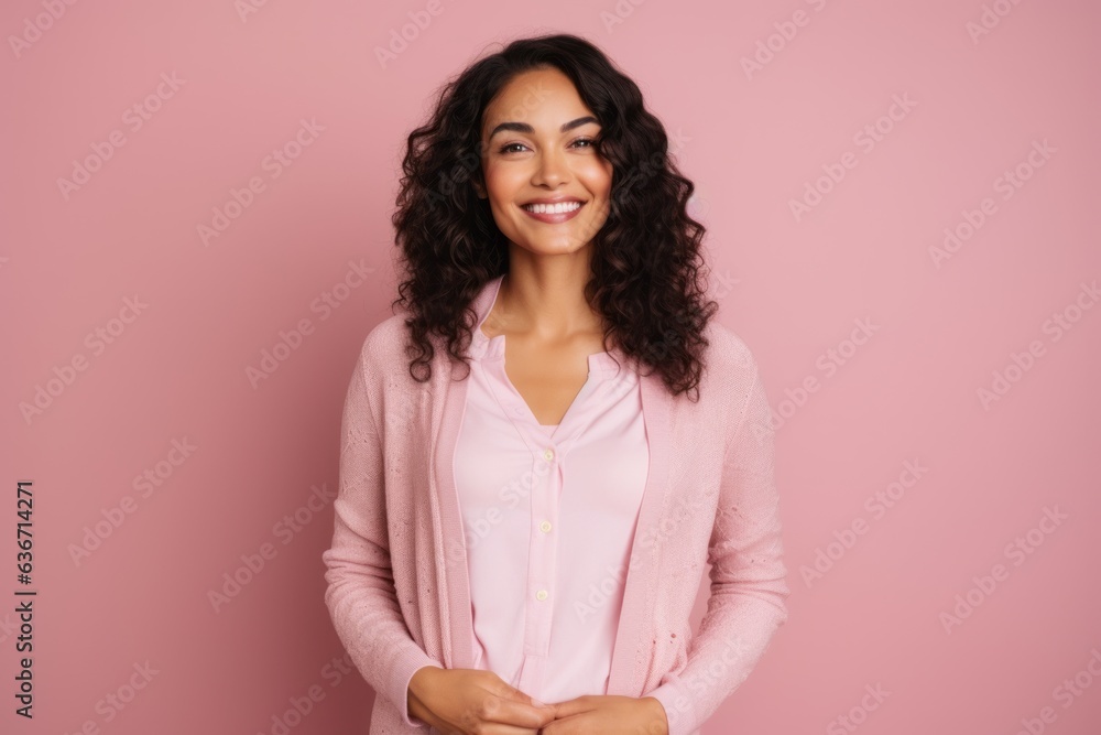 Portrait of a smiling young african american woman looking at camera isolated over pink background Portrait of a smiling young african american woman looking at camera isolated over pink background