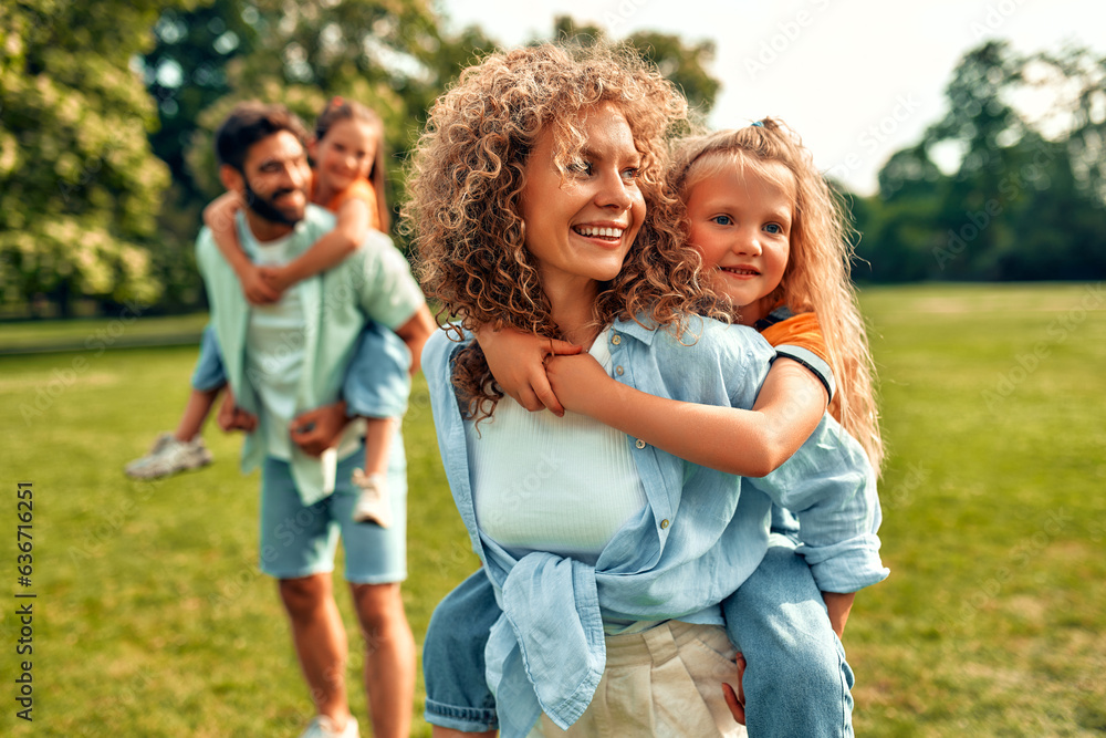 Happy family relaxing in the park