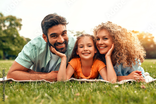 Happy family relaxing in the park