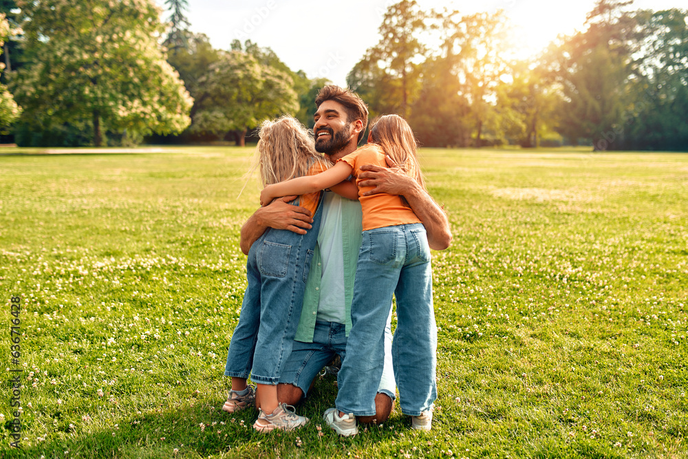 Fototapeta premium Happy family relaxing in the park
