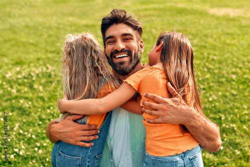 Happy family relaxing in the park