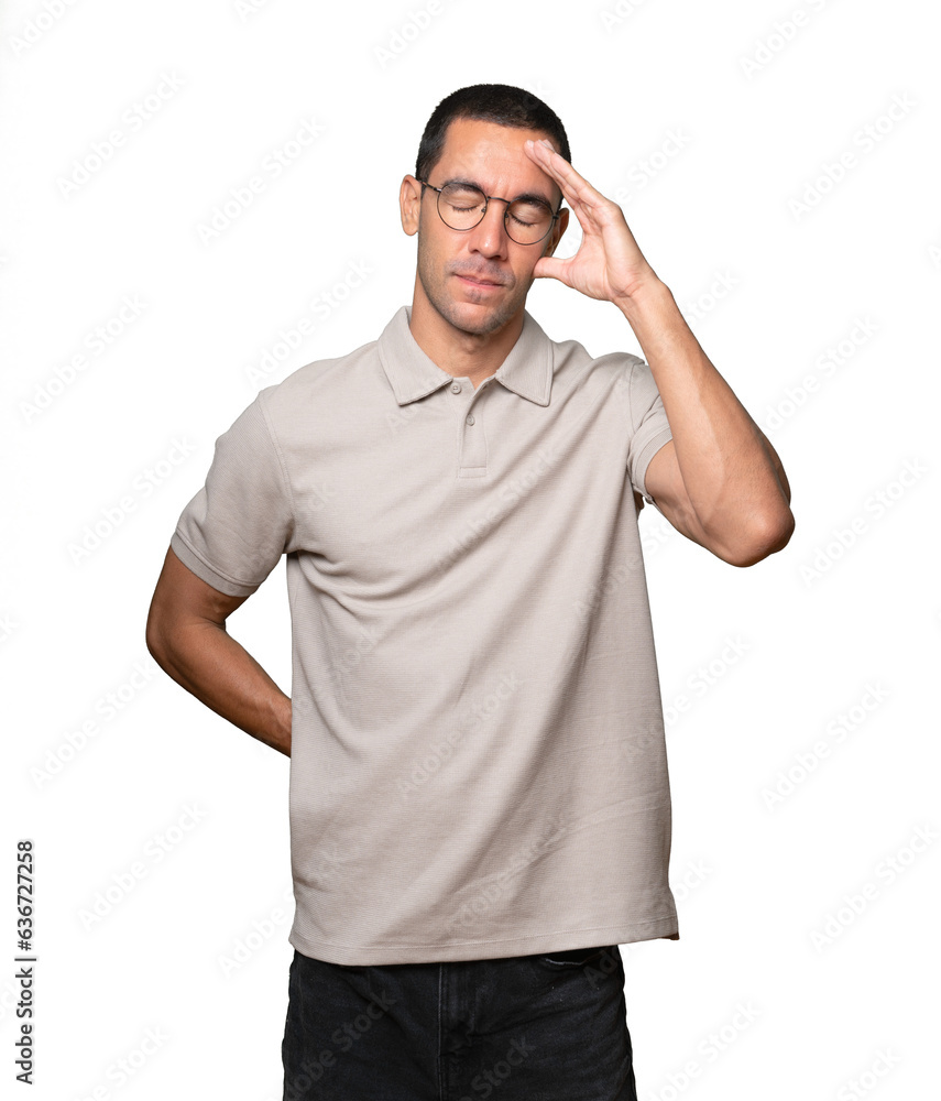 Serious young man doing a gesture of defeated Serious young man doing a gesture of defeated