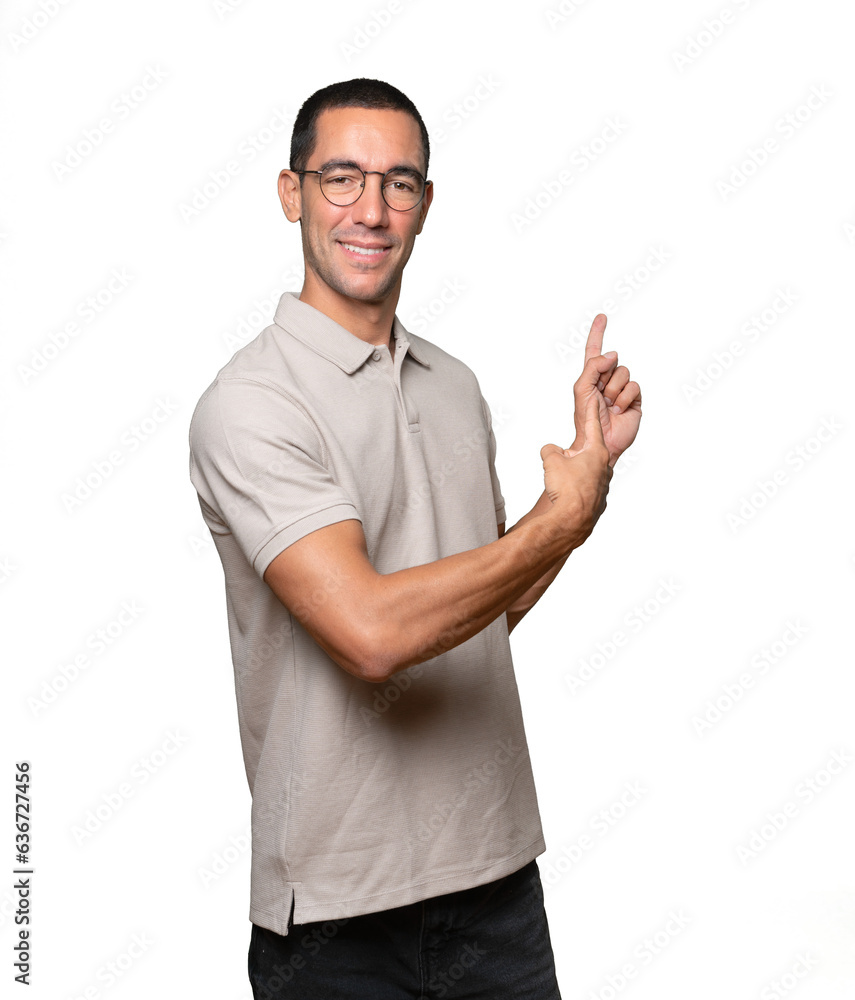 Happy young man making a gesture of calling with the hand Happy young man making a gesture of calling with the hand