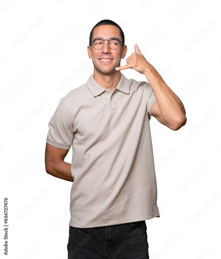 Hesitant young man making a gesture of calling with the hand Hesitant young man making a gesture of calling with the hand