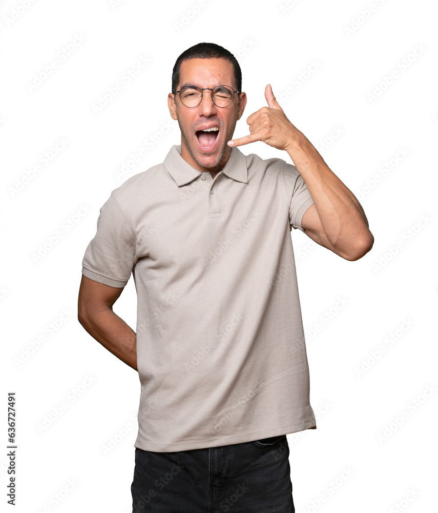 Friendly young man making a gesture of sending a kiss with his hand Friendly young man making a gesture of sending a kiss with his hand