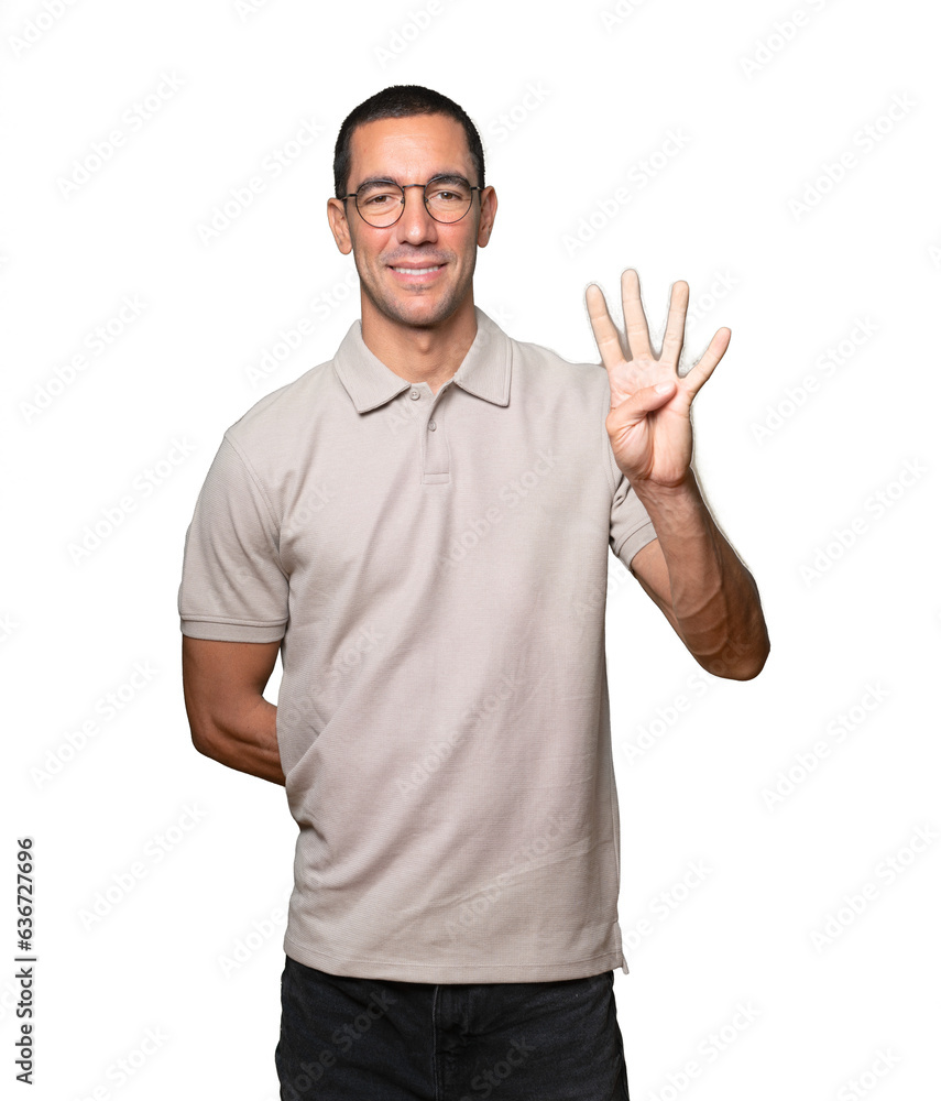 Young man making a number five gesture Young man making a number five gesture