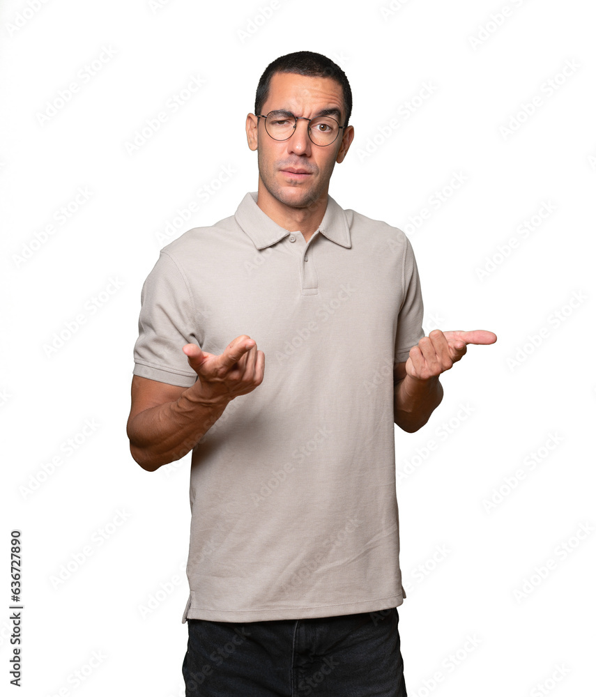 Amazed young man pointing at you with his finger Amazed young man pointing at you with his finger