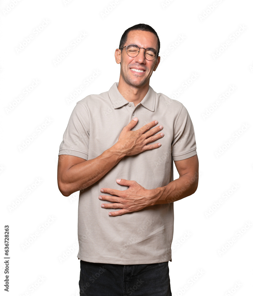 Happy young man laughing against background Happy young man laughing against background