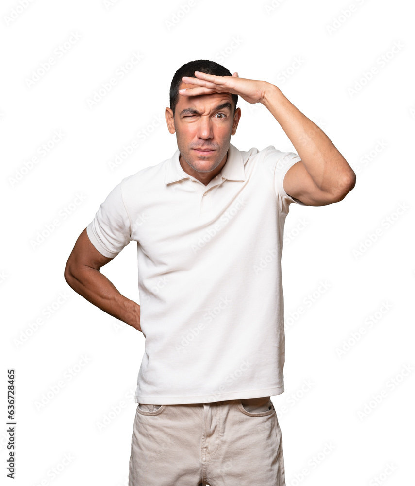 Concentrated young man with a gesture of looking far Concentrated young man with a gesture of looking far