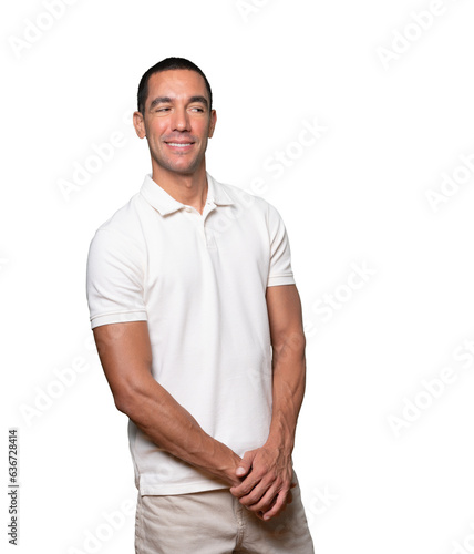 Happy young man posing against background