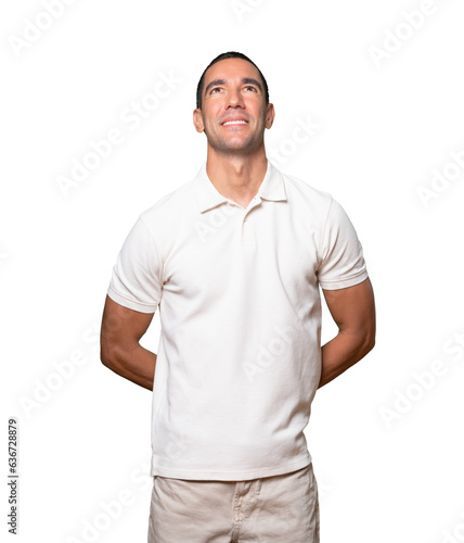 Happy young man looking against background