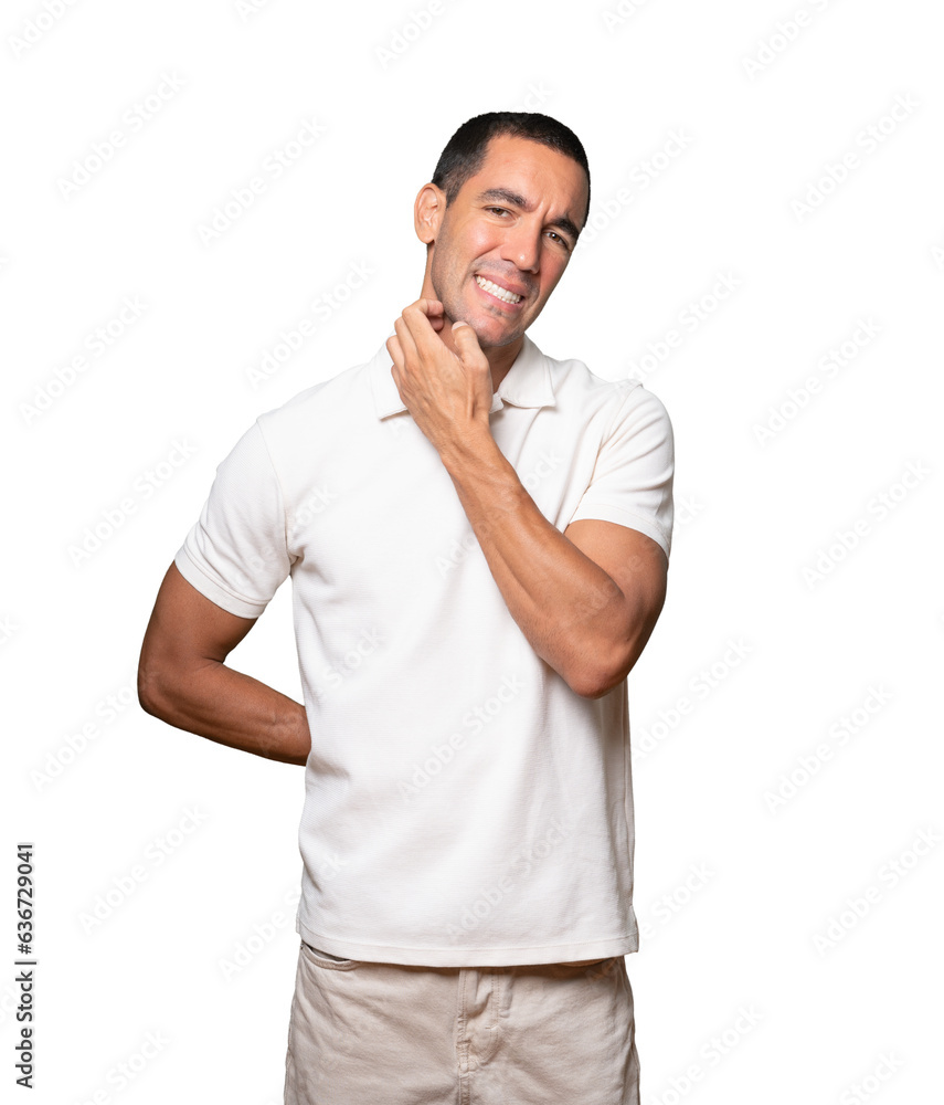 Concerned young man making a scratching gesture Concerned young man making a scratching gesture