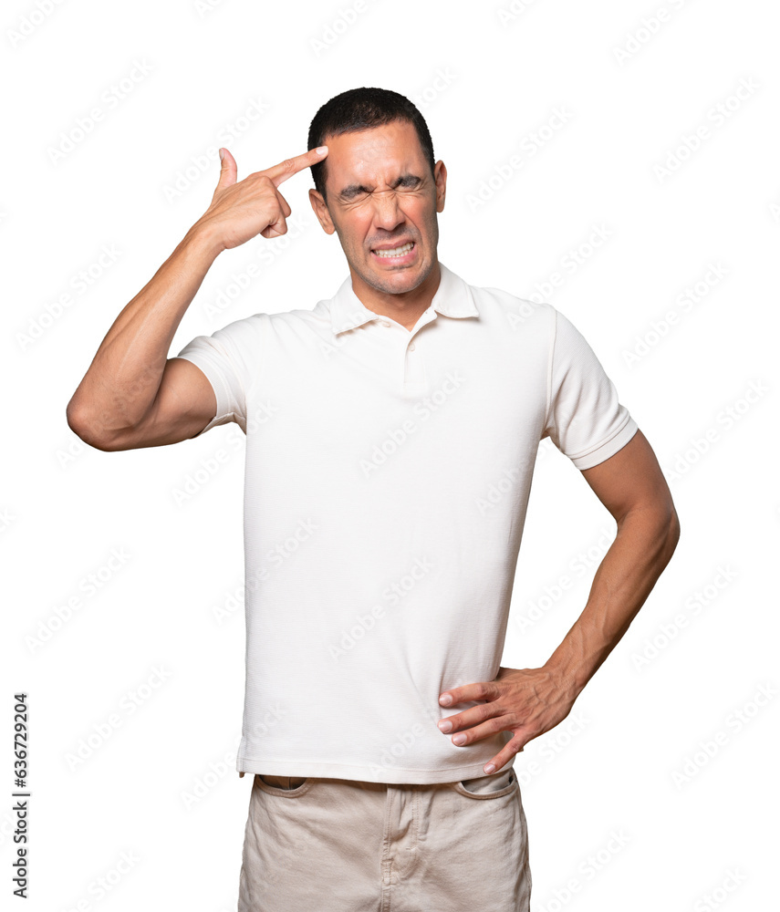Depressed young man making a suicide gesture Depressed young man making a suicide gesture