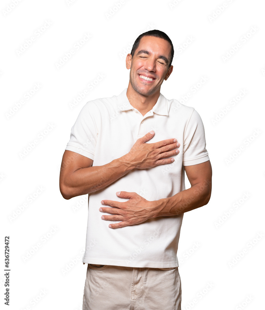 Happy young man laughing against background