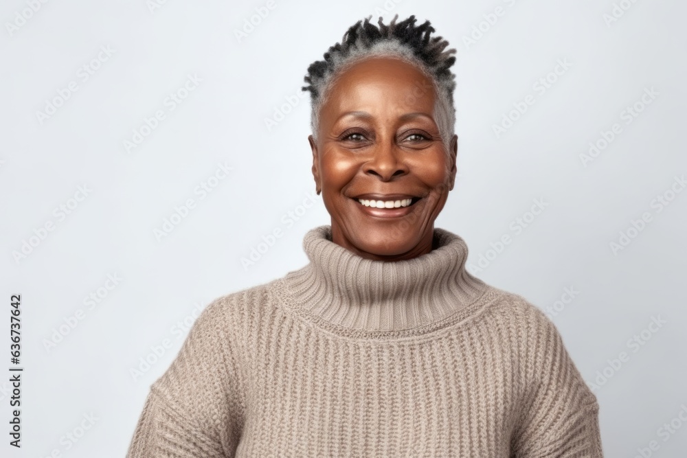 Portrait of smiling african american woman in sweater looking at camera Portrait of smiling african american woman in sweater looking at camera