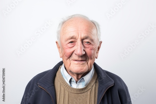 Portrait of a senior man with wrinkles on his face, looking at the camera