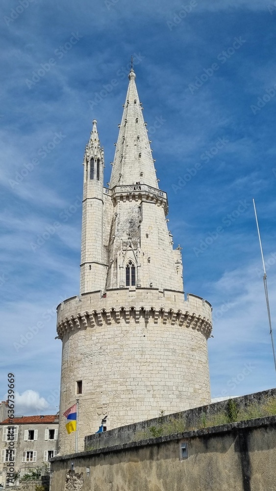 Vertical shot of The tower of the old castle in La Rochelle in France under the blue sky