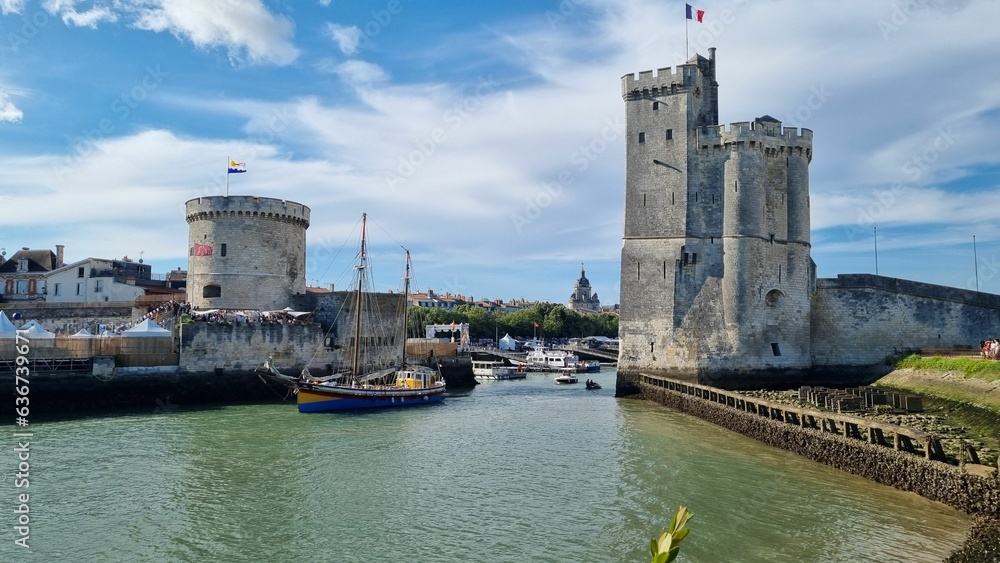 Closeup of The harbor of La Rochelle in France, with parts of the old castle under the blue sky