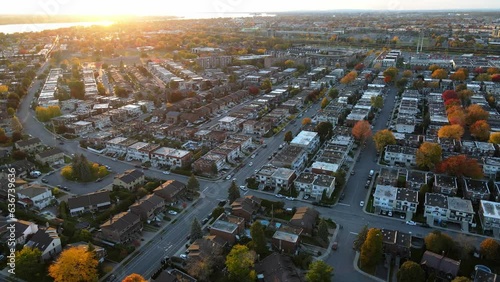 Aerial view of tightly located houses in Montreal suburban area. Real estate development. Real estate, top down view of townhouses. Drone footage of Canadian Neighborhood in autumn. 