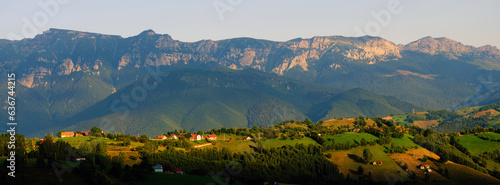 Scenic view over Bucegi Mountains (Muntii Bucegi) in Romania in a sunny sunset summer day, Romania, Europe photo