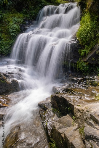 Fototapeta Naklejka Na Ścianę i Meble -  Handheld shot taken of a waterfall in The Rock garden, darjeeling