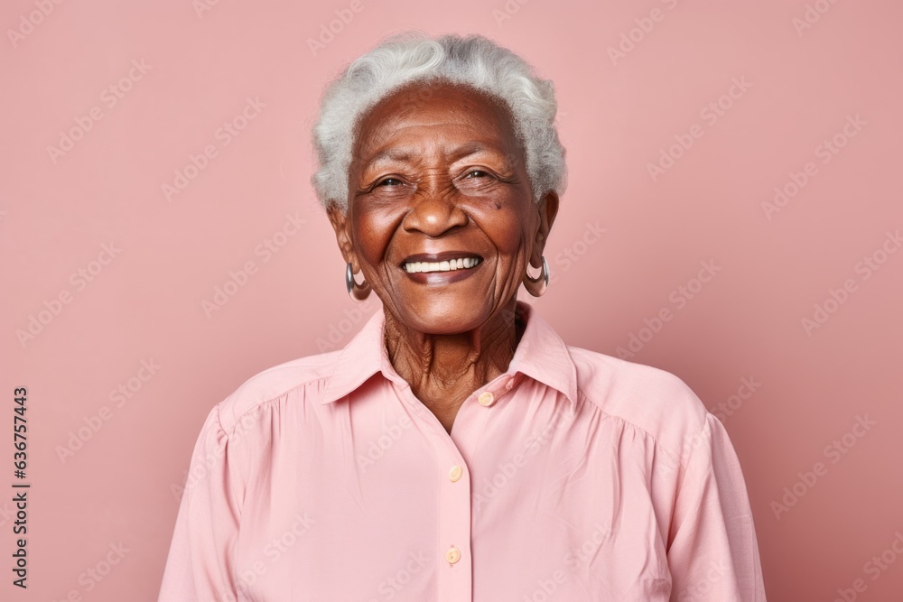 Portrait of a 100-year-old elderly Nigerian woman in a pastel or soft colors background wearing a sporty polo shirt Portrait of a 100-year-old elderly Nigerian woman in a pastel or soft colors background wearing a sporty polo shirt