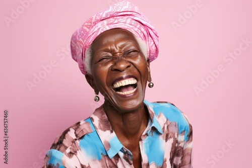 Portrait of a 100-year-old elderly Nigerian woman in a pastel or soft colors background wearing a fun graphic tee