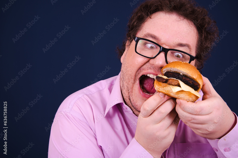 Funny fat man on a diet eats hamburgers. Funny fat man on a diet eats hamburgers.