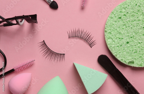 Set of beauty products, make-up accessories on a pink background. Flat lay
