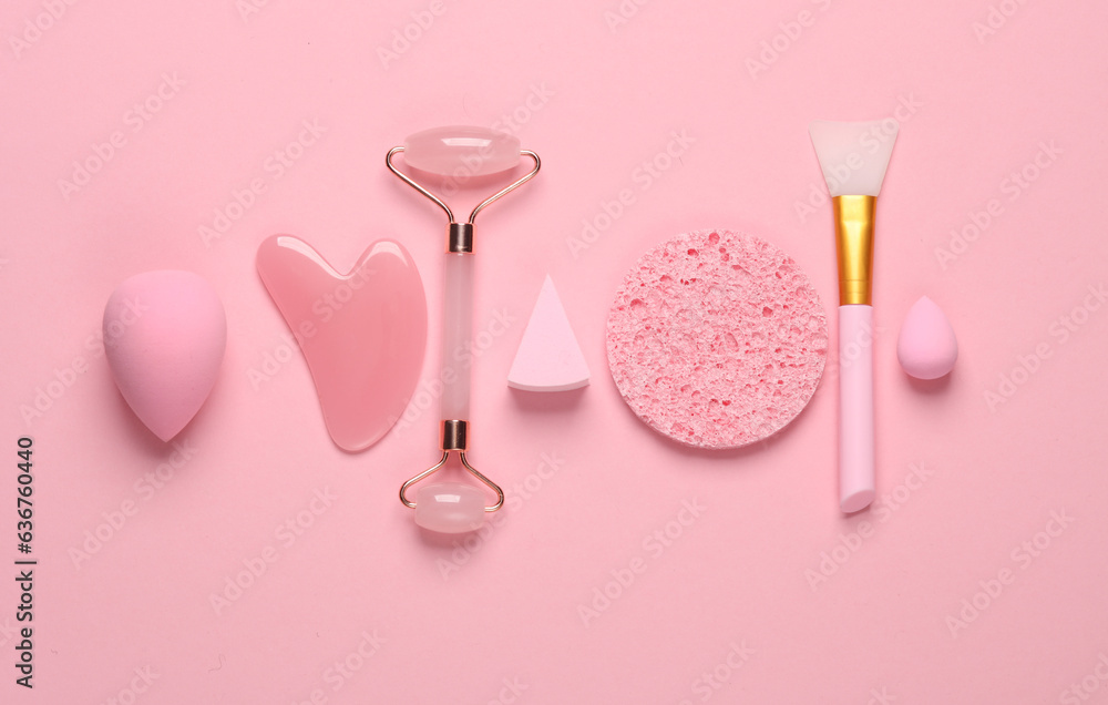 Beauty products on a pastel background. Pink color trend. Flat lay