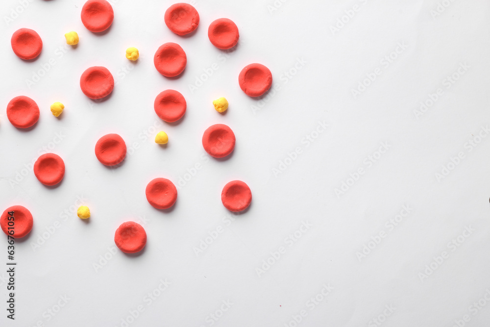 Red blood cells with lipids model on white background. Cholesterol. Copy space Red blood cells with lipids model on white background. Cholesterol. Copy space