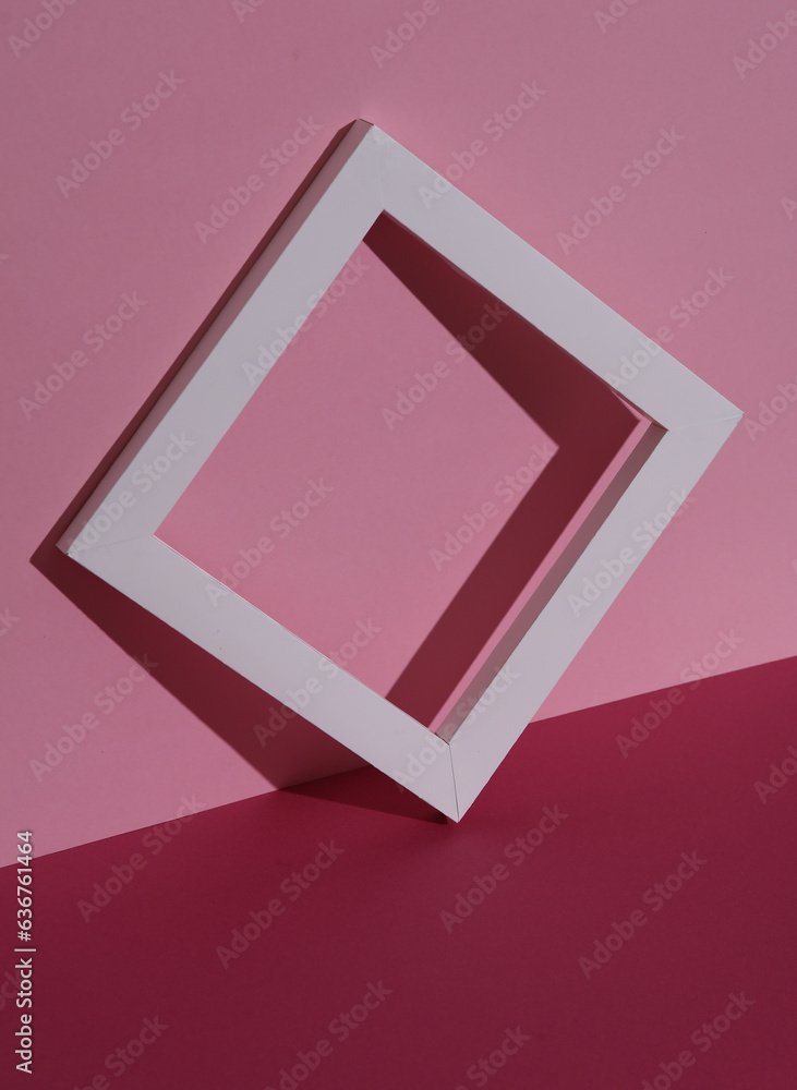 White frame on pink background with shadow. Creative layout, minimalism White frame on pink background with shadow. Creative layout, minimalism